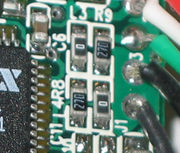 This image shows some surface mount resistors, including two zero ohm resistors. Wire links are often made with zero ohm resistors, so they can be inserted by a resistor-inserting machine.